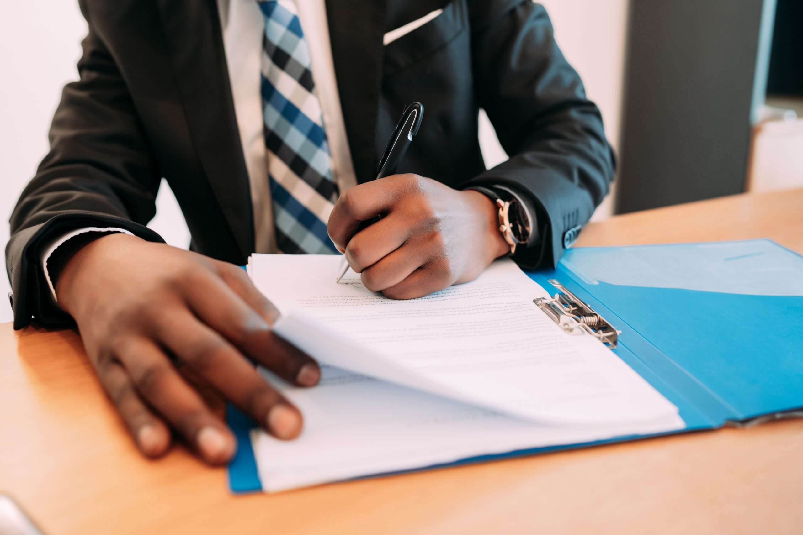 Professional businessman working with documents at his modern office. Business concept.
